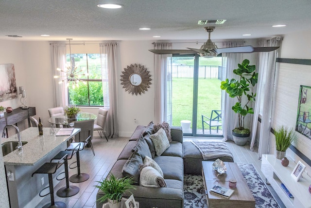 a living room with multiple windows and a bar